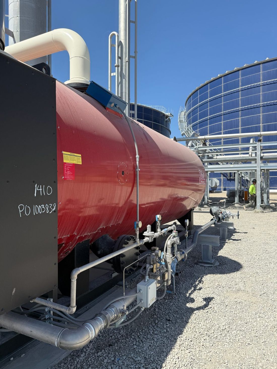 Industrial vessel and piping installed at an outdoor plant site